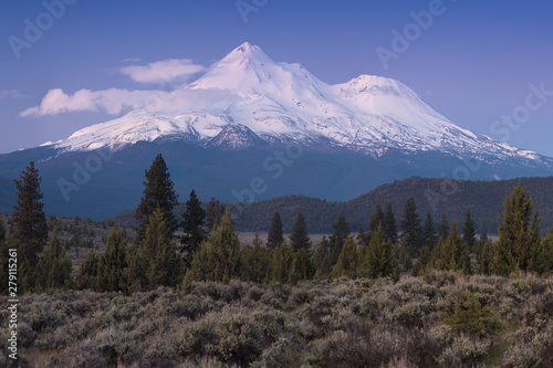 View of Mount Shasta Volcano with glaciers, in California, USA. Panorama from north. Mount Shasta is a potentially active volcano at the southern end of the Cascade Range in Siskiyou County