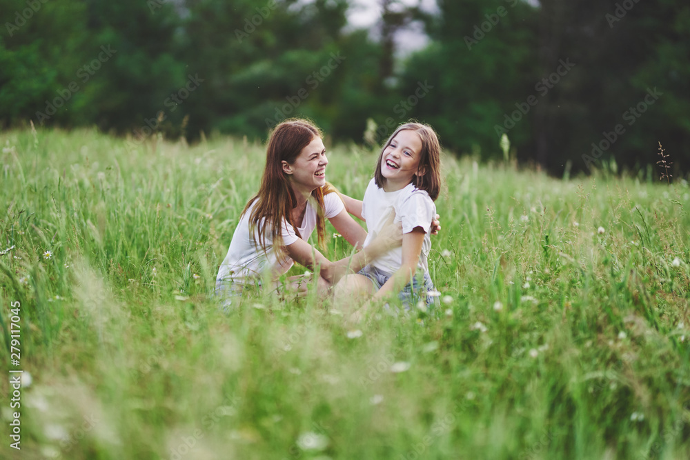 happy mother and daughter in the park happy mother and daughter in the park