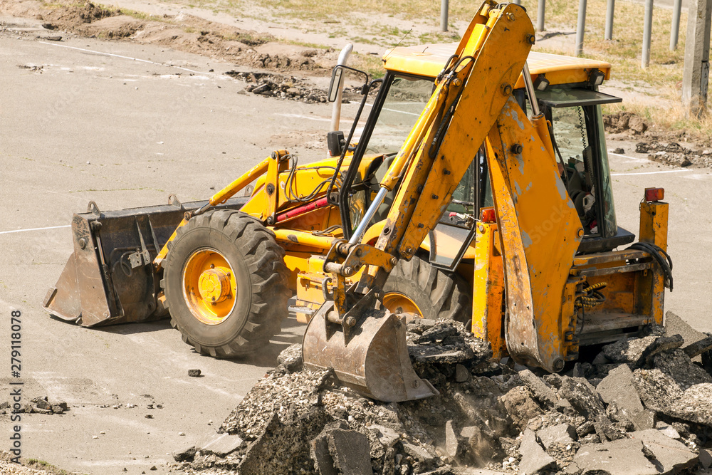 Tractor Dismantles Asphalt Tractor Dismantles Asphalt