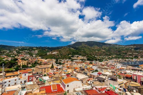 beautiful bright view to a Mediterranean town with mountain and harbor