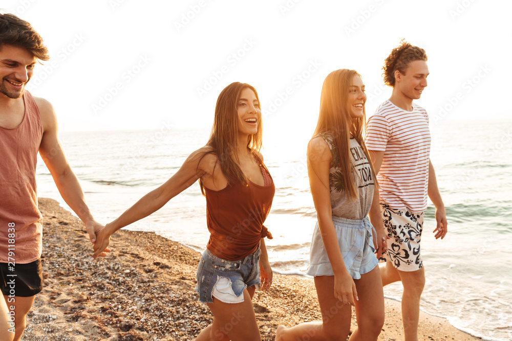 Group of cheerful happy young friends having fun Group of cheerful happy young friends having fun