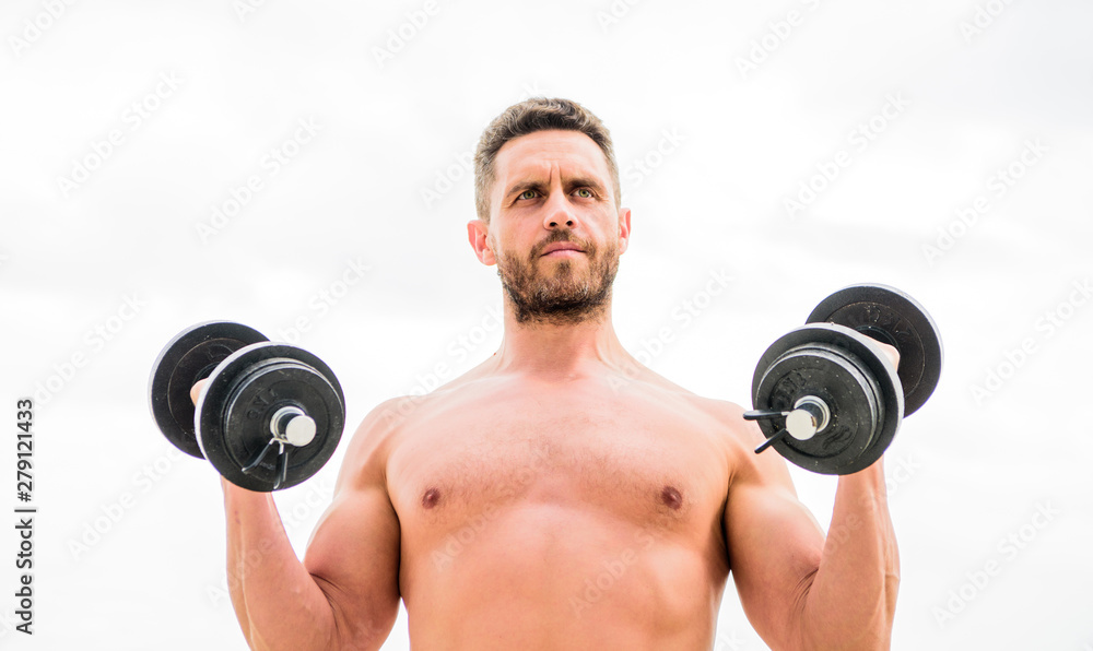 Dare to be great. Muscular man exercising with dumbbell. Dumbbell exercise. Sportsman strong biceps triceps. Gym workout. Workout fitness sport. Workout concept. Healthy mind in a healthy body