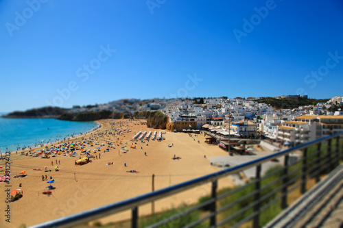 View on the beach Praia do Tunel and Albufeira in Algarve, Portugal.Tilt shift effect.