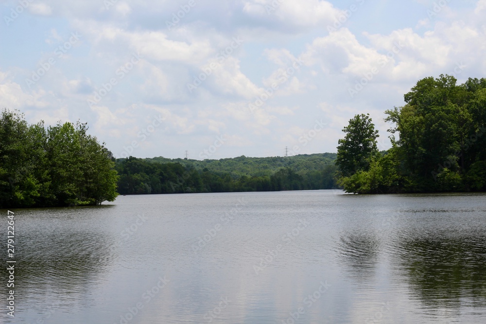 The peaceful park lake on a sunny spring day. The peaceful park lake on a sunny spring day.