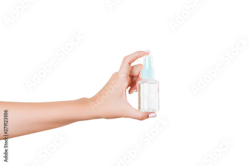 Female hand holding cream bottle of lotion isolated. Girl give tube cosmetic products on white background