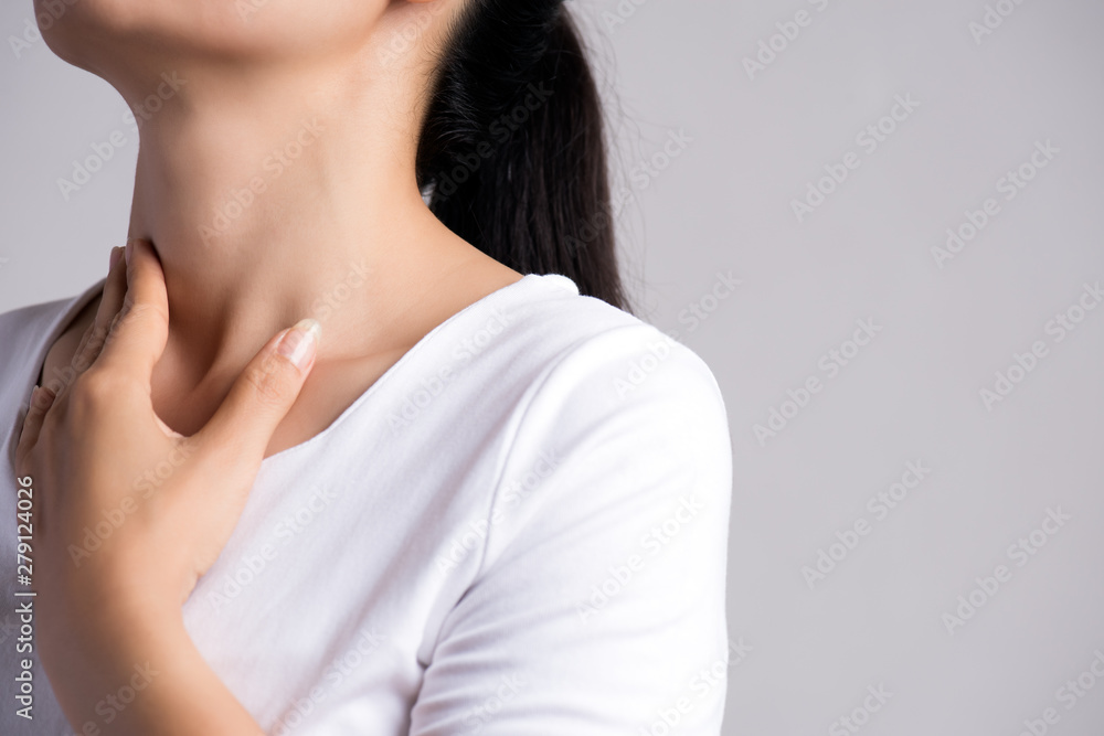 Sore Throat. Closeup Of Beautiful Young Woman Hand Touching Her Ill Neck. Healthcare and medical concept. Sore Throat. Closeup Of Beautiful Young Woman Hand Touching Her Ill Neck. Healthcare and medical concept.