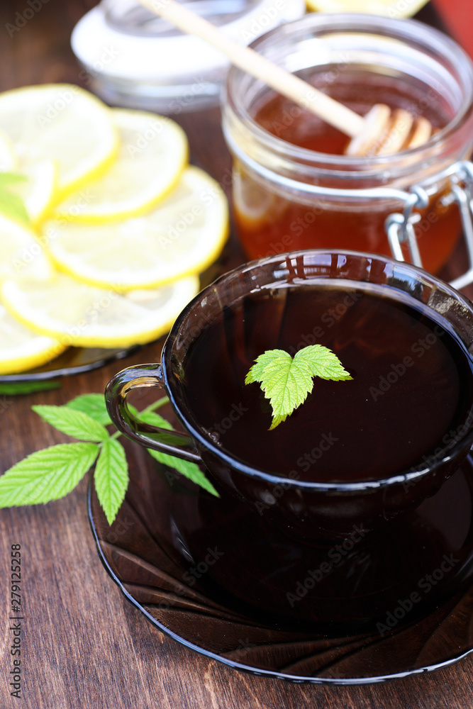 Fresh honey with a cup of black tea Fresh honey with a cup of black tea