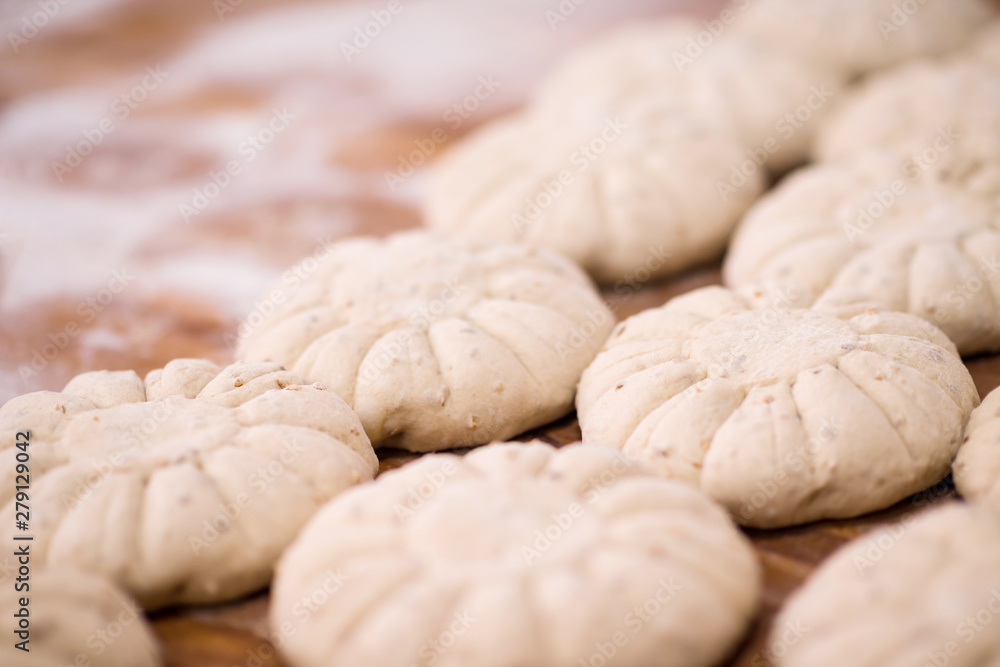 balls of dough bread getting ready to be baked balls of dough bread getting ready to be baked