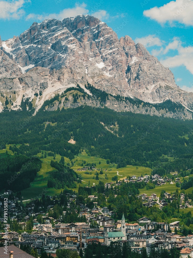 Mountain settlement, a small town in the mountains. Mountain summer landscape in the Dolomites in Northern Italy. Air view of the national Park Tre Cime di Lavaredo.