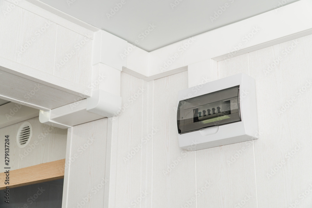 White plastic electric guard on a white wall White plastic electric guard on a white wall