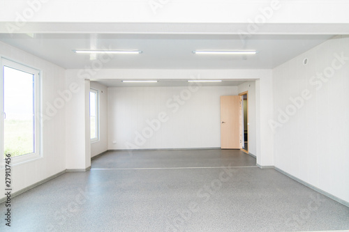 Light white empty office room with bright lighting