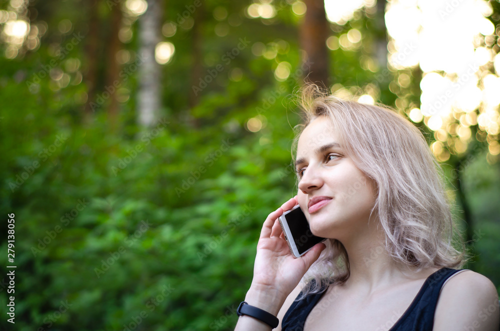 Girl talking on the phone and laughing. Photo. Girl talking on the phone and laughing. Photo.