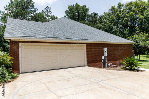 Red brick house cream colored garage