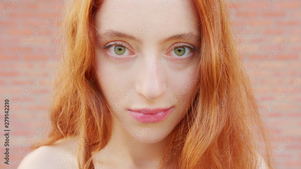 Red-haired lady. Emotion. Smile Closeup shot Red-haired lady. Emotion. Smile Closeup shot