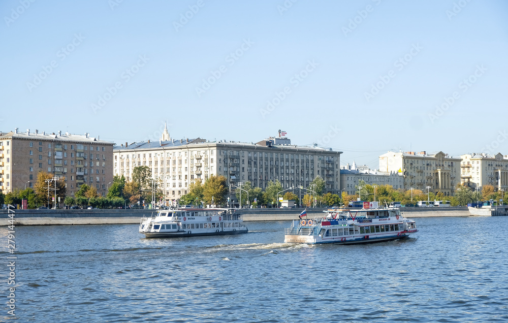 Pleasure boats on the Moscow river, embankment of the Moscow river