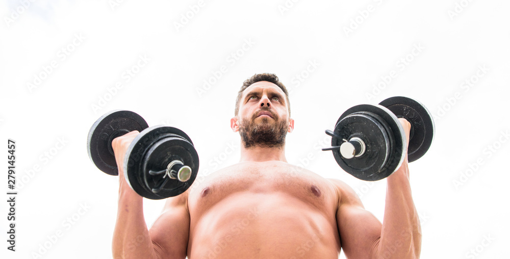 Muscular man exercising with dumbbell. Sportsman with strong torso. Sport equipment. Fitness and bodybuilding sport. Sport lifestyle. Success is choice. Winning is habit. Dumbbell exercise gym Muscular man exercising with dumbbell. Sportsman with strong torso. Sport equipment. Fitness and bodybuilding sport. Sport lifestyle. Success is choice. Winning is habit. Dumbbell exercise gym