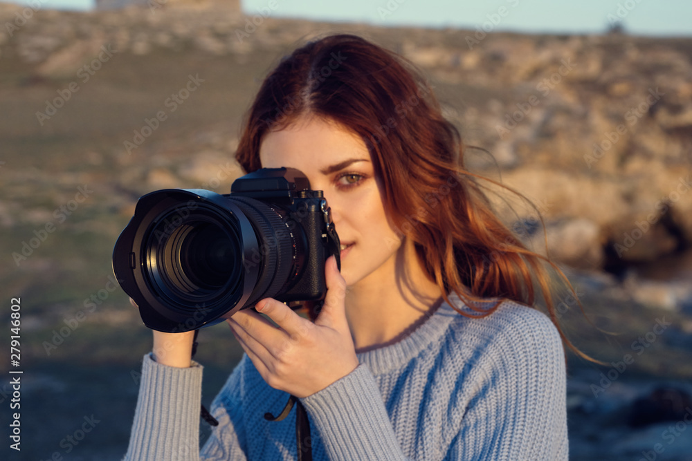 woman taking photo with digital camera woman taking photo with digital camera