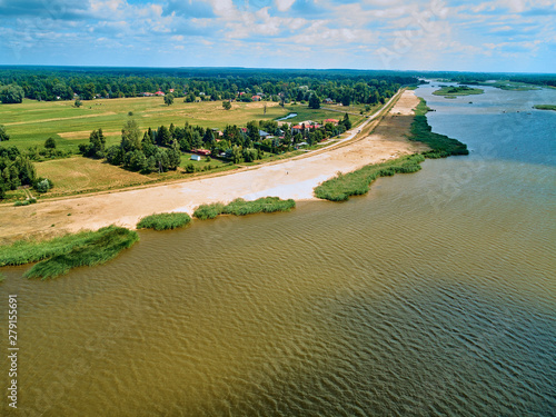 Beautiful panoramic aerial drone view to the place of connecting the Bug and Narew rivers with a warm summer day in July, Poland, Masovian © udmurd