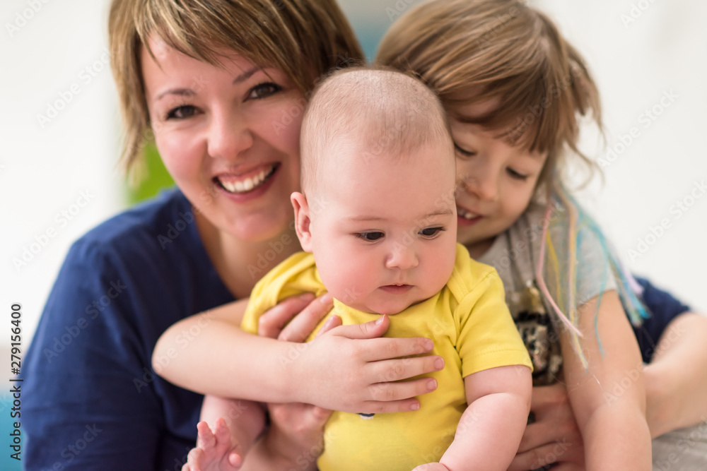 portrait of young mother with her kids portrait of young mother with her kids
