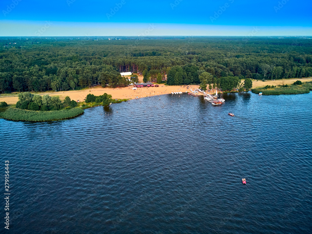 Obraz premium Beautiful panoramic aerial drone view to the place of connecting the Bug and Narew rivers with a warm summer day in July, Poland, Masovian