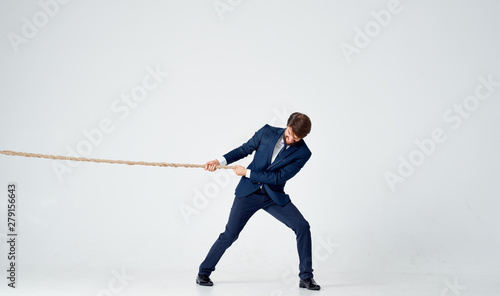 businessman climbing a rope