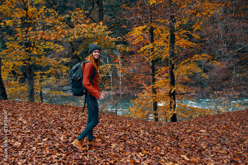 young woman running in autumn forest © SHOTPRIME STUDIO