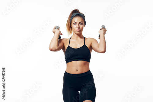 young woman with dumbbells