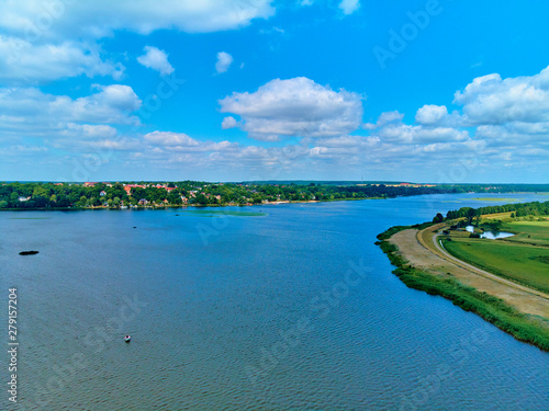 Fototapeta Naklejka Na Ścianę i Meble -  Beautiful panoramic aerial drone view to the place of connecting the Bug and Narew rivers with a warm summer day in July, Poland, Masovian