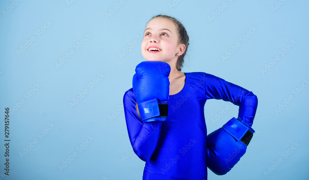 Female boxer change attitudes within sport. Rise of women boxers. Girl cute  boxer on blue background. With great power comes great responsibility.  Contrary to stereotype. Boxer child in boxing gloves Photos