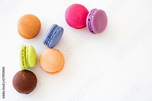 Fotografie Colorful macarons on white background, close up view