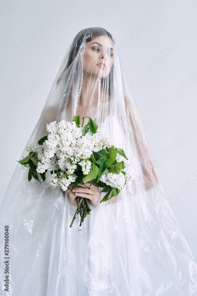 bride in white dress with a bouquet of flowers bride in white dress with a bouquet of flowers