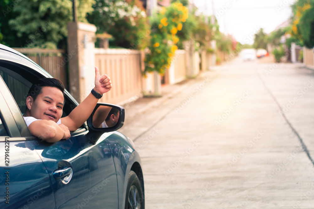 car with man hands up lifestyle driving freedom on street in city blurred background.For automotive automobile or transport transportation image.