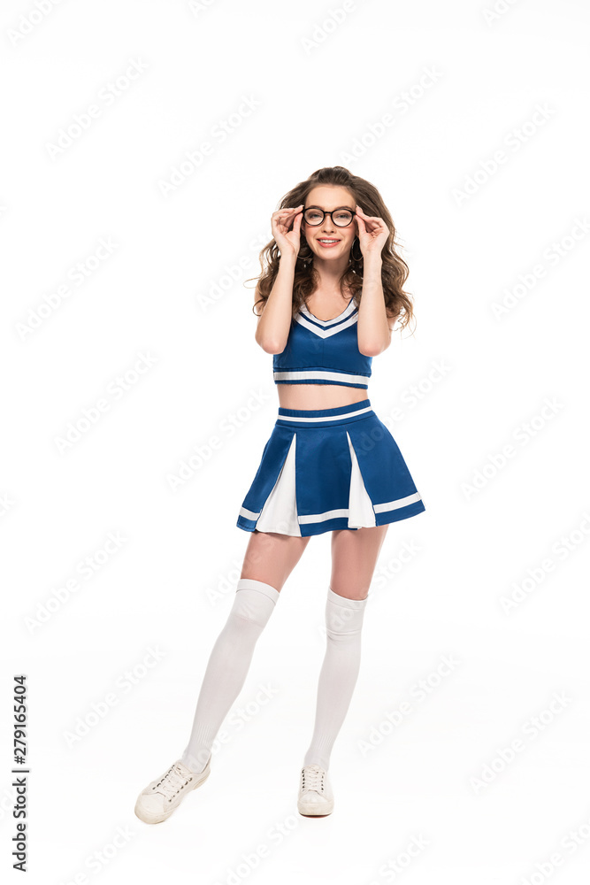 sexy happy cheerleader girl in blue uniform and glasses isolated on white sexy happy cheerleader girl in blue uniform and glasses isolated on white