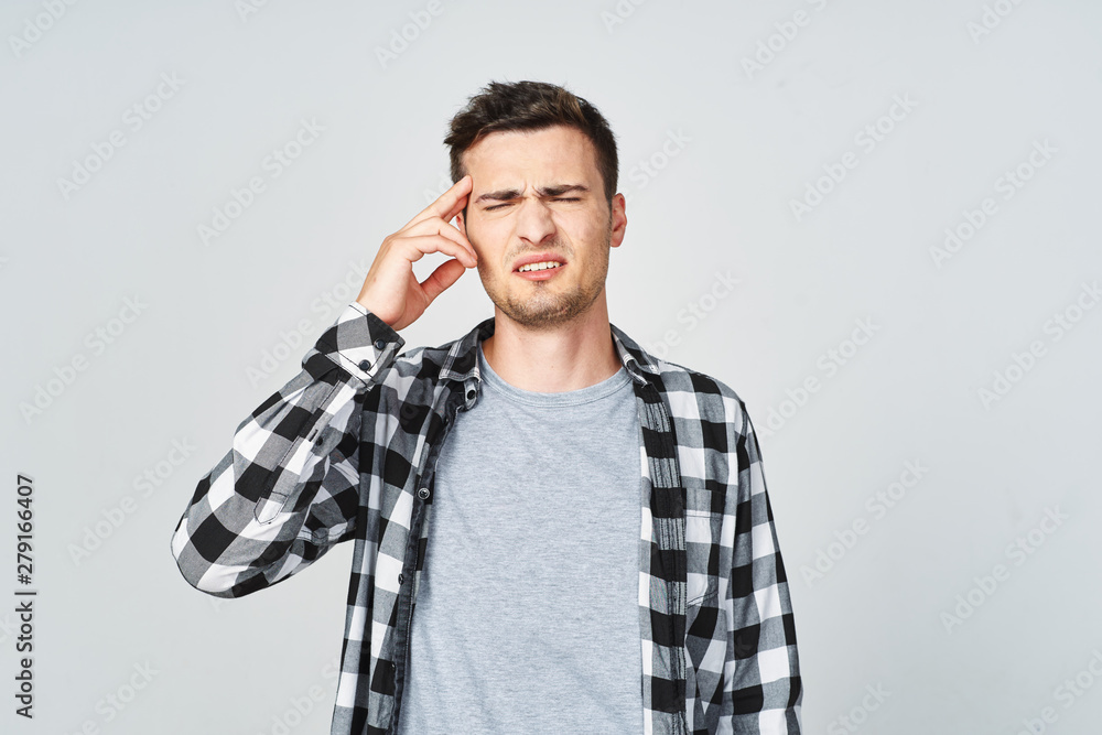young man talking on the phone isolated on white
