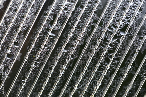 Water droplets on cellular polycarbonate, pattern and structure with variable scale and direction. © Alexander
