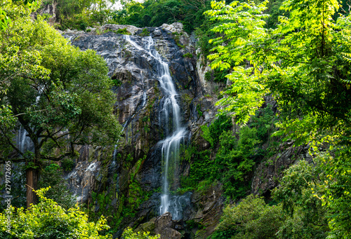 Fototapeta Naklejka Na Ścianę i Meble -  Waterfall in tropical forest at Khlong Lan National park, Kamphaeng Phet, Thailand.