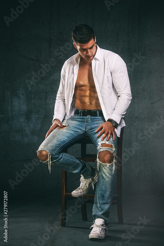 Muscular Men in Jeans Wearing Shirt Exposing his Muscular Build