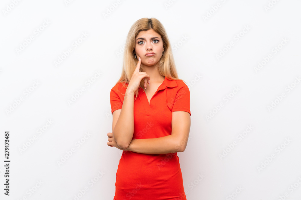 Teenager girl over isolated white background Looking front Teenager girl over isolated white background Looking front