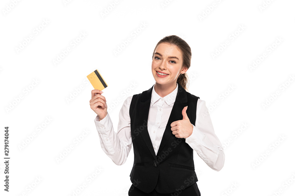 happy young waitress holding credit card and showing thumb up isolated on white happy young waitress holding credit card and showing thumb up isolated on white