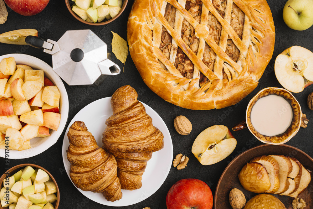 Fresh apples amidst pastry and drink Fresh apples amidst pastry and drink