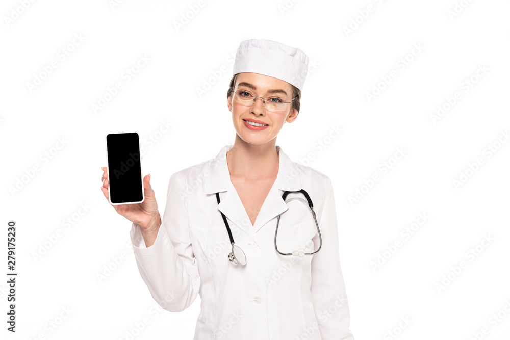 young happy doctor in white coat with stethoscope showing smartphone with blank screen isolated on white young happy doctor in white coat with stethoscope showing smartphone with blank screen isolated on white
