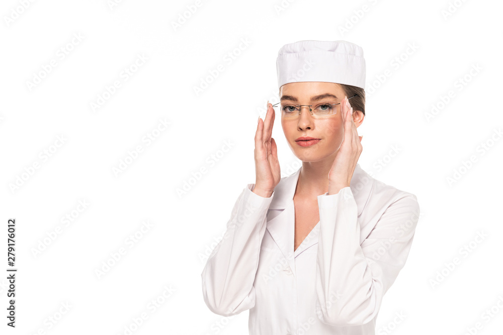 young doctor in white coat touching glasses isolated on white young doctor in white coat touching glasses isolated on white