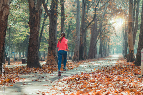 Woman Jogging Outdoors in Park