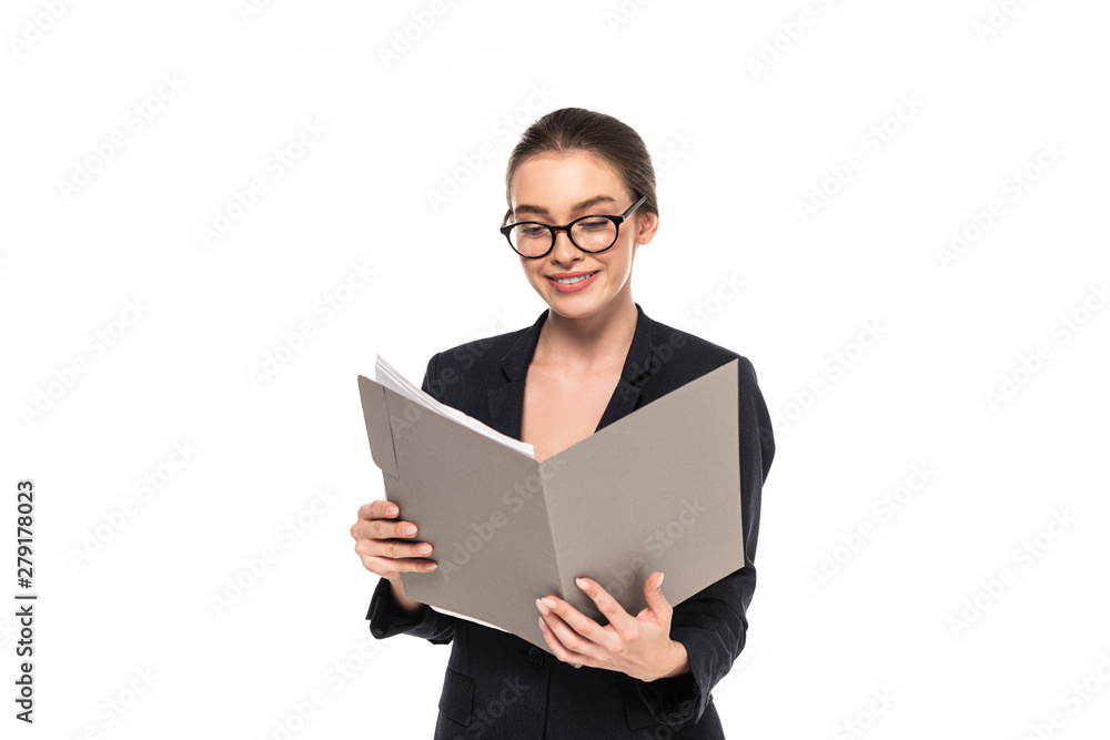 young happy successful businesswoman in black suit and glasses reading documents in folder isolated on white