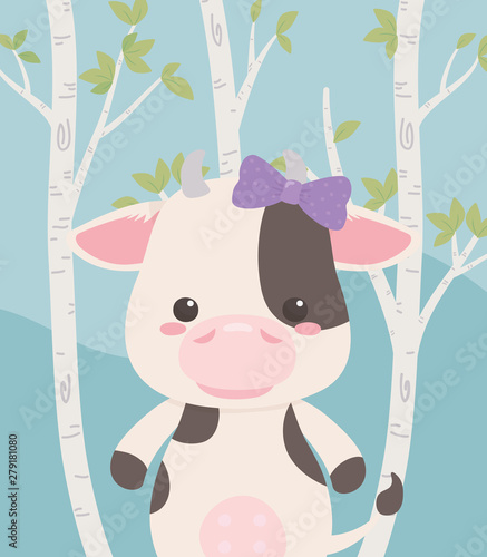cute and little cow in the field