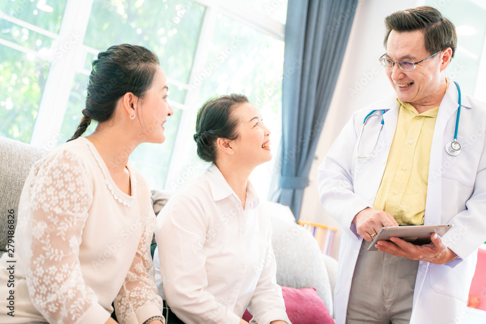 Happy medical doctor consultant with middle age women Happy medical doctor consultant with middle age women