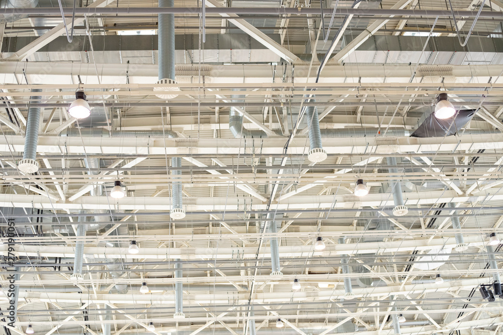Supply and exhaust ventilation system on the ceiling in the exhibition hall. Lighting in the warehouse.