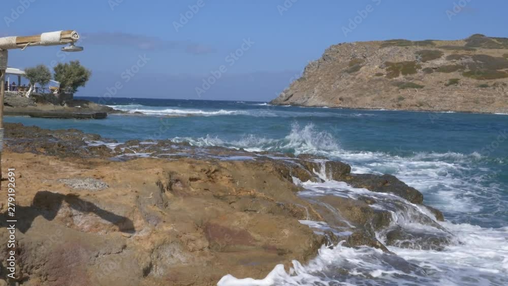The beautiful Mochlos beach, Nr Sitia, North Eastern Crete with St Nicholas Island offshore The beautiful Mochlos beach, Nr Sitia, North Eastern Crete with St Nicholas Island offshore
