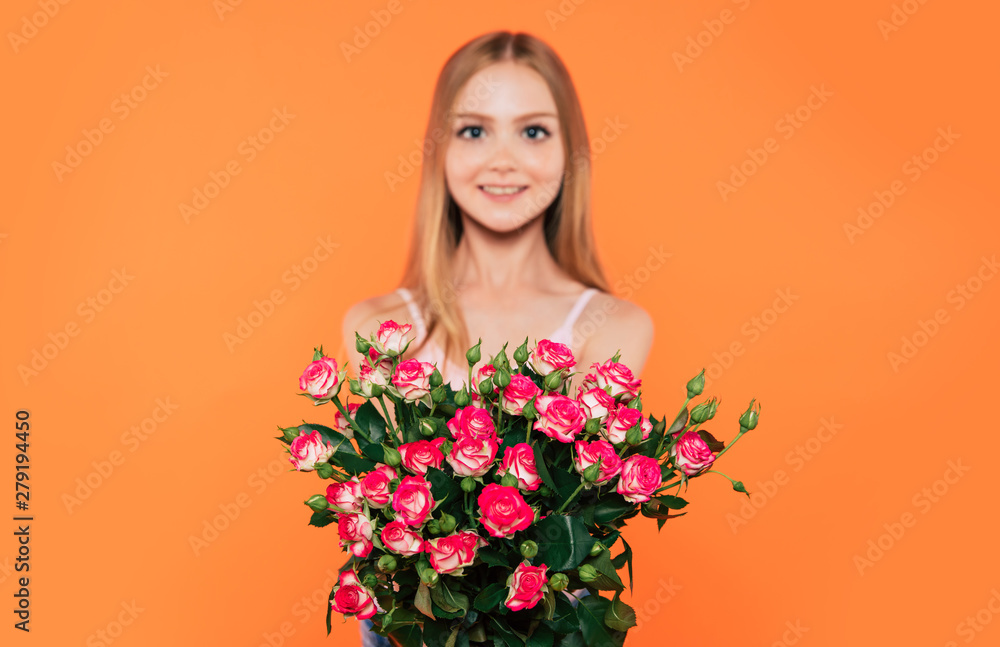 Beautiful, cute, lovely, smiling blonde little girl with happy eyes holds large bouquet of flowers isolated in studio. Birthday, holidays, Valentines day, mothers day concepts. Beautiful, cute, lovely, smiling blonde little girl with happy eyes holds large bouquet of flowers isolated in studio. Birthday, holidays, Valentines day, mothers day concepts.