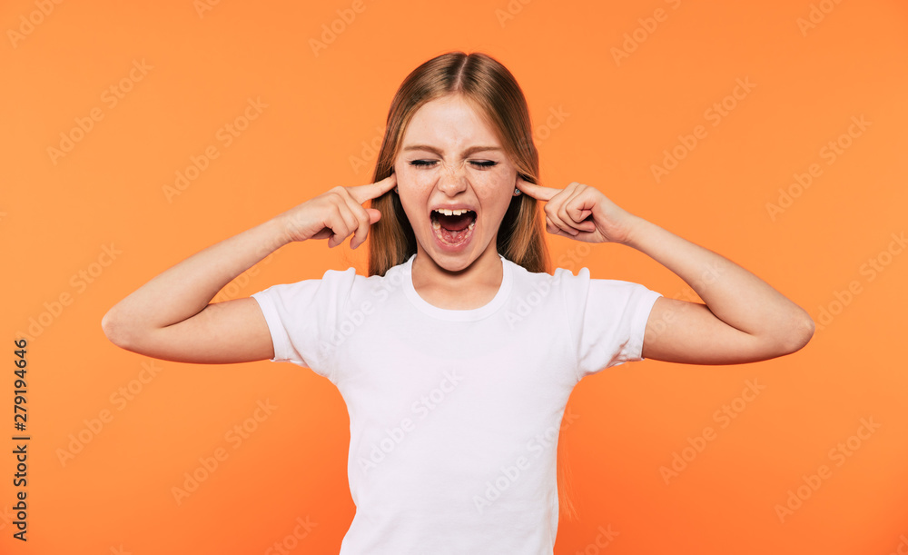 Shouting small blonde girl portrait isolated on yellow background Shouting small blonde girl portrait isolated on yellow background